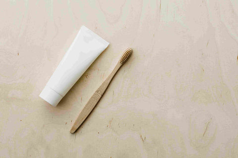 A Toothpaste tube and a brush