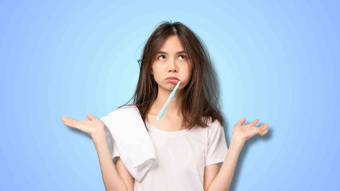 A woman brushing her teeth