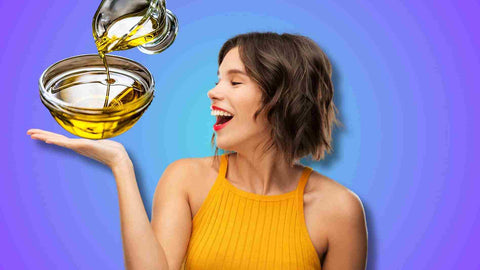 A woman showing the oil for oil pulling