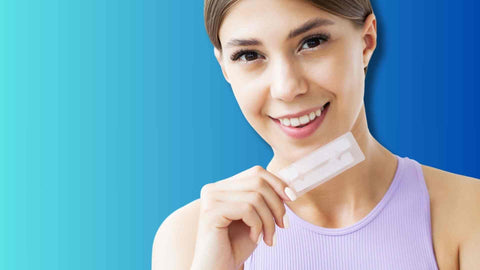 A woman using whitening strips