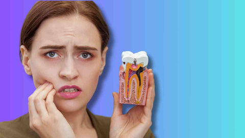 A lady showing tooth cavity model