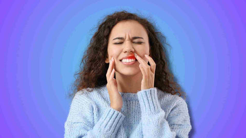A woman experiencing oral problem