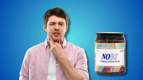 A man besides a jar of NOBS Toothpaste Tablets