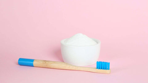 A baking soda and toothbrush