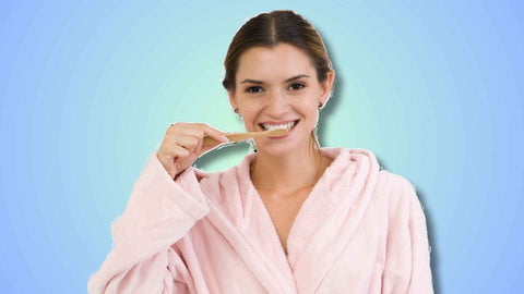 a girl brushing her teeth