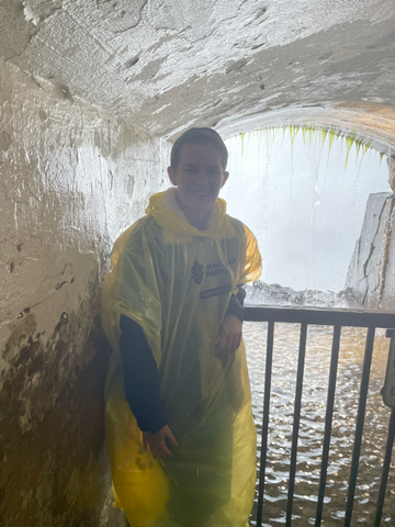Standing in front of one of the lookouts in the tunnels at Journey Behind The Falls