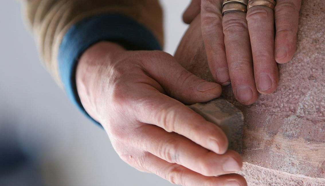 Hand polishing rocks