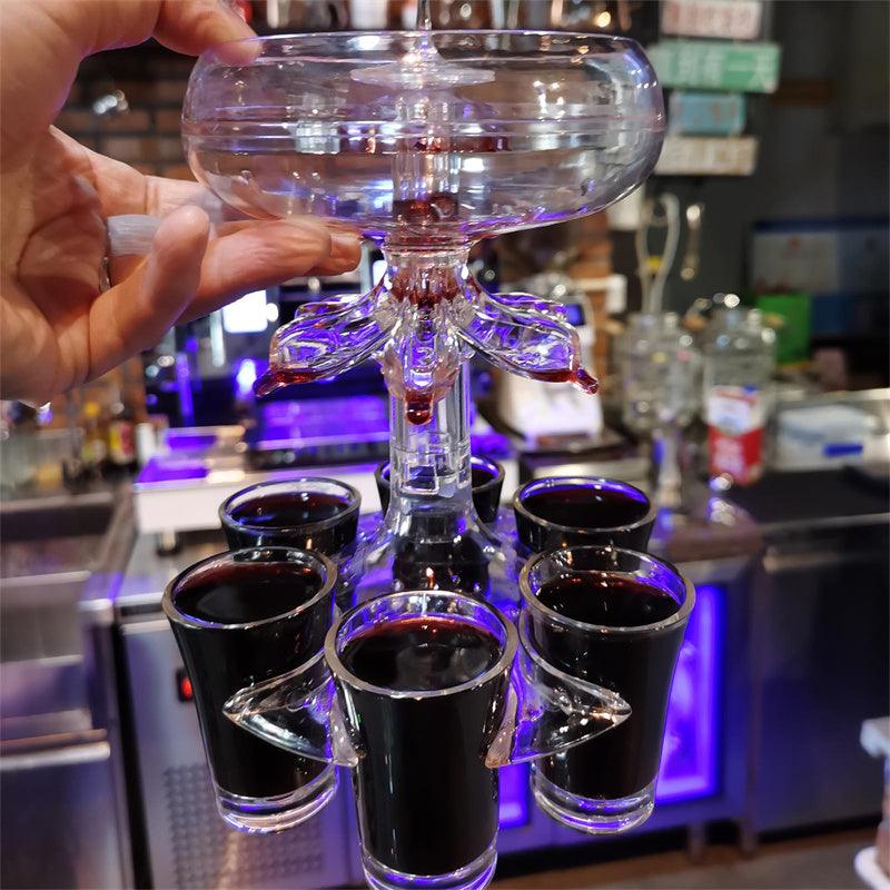 Close-up van shotglas dispenser die meerdere shots tegelijk serveert.