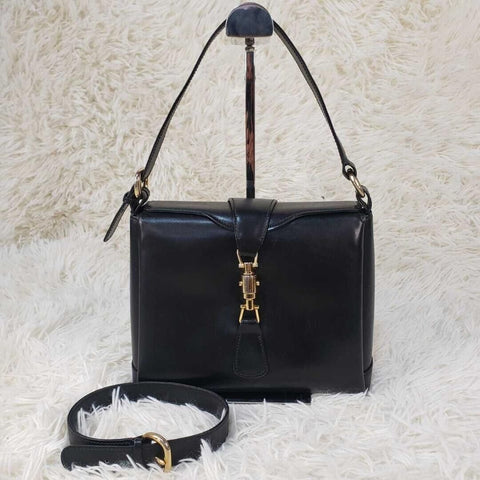 RARE, Gucci, Jackie mod, navy blue leather, boxy, cross body or shoulder purse with bold gold tone accents, a flap strap closure at the center