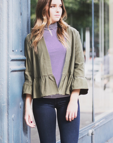 ruffle jacket with a striped mock neck top