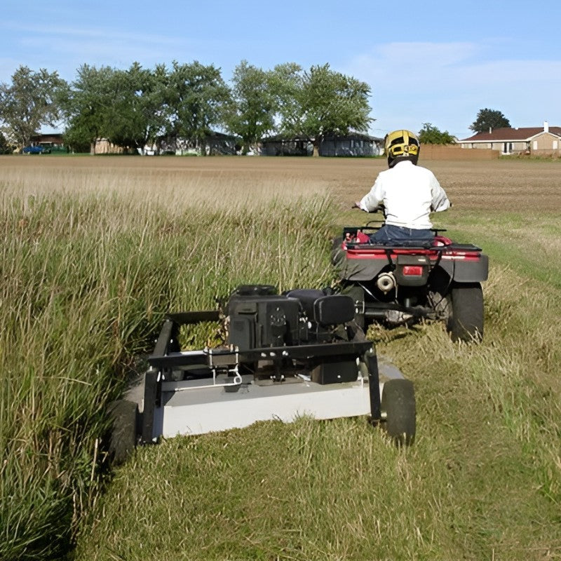 AcrEase MR55BE 57 in 27HP Rough Cut Tow Behind Mower rear view pulled by atv in tall grass field