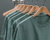 Rack of green t-shirts