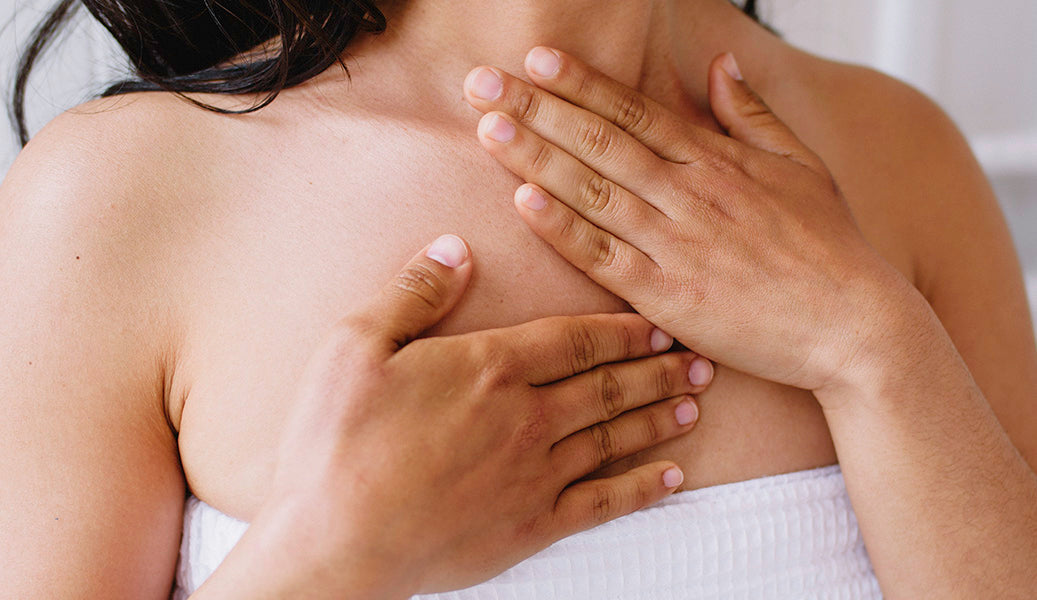woman massaging chest