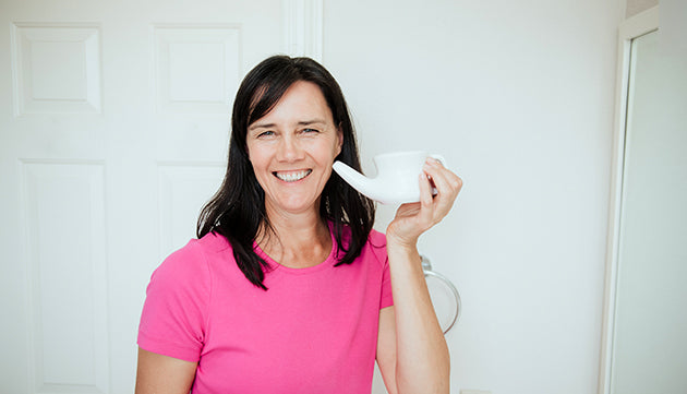 Banyan friend Jennifer using a neti pot (nasal rinse cup)