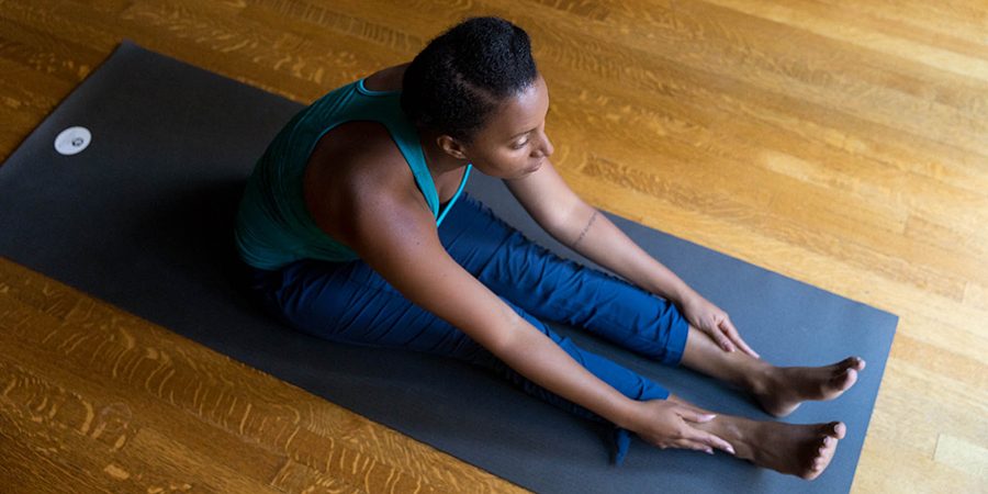 Banyan friend Jonelle getting ready for a yoga routine in studio.