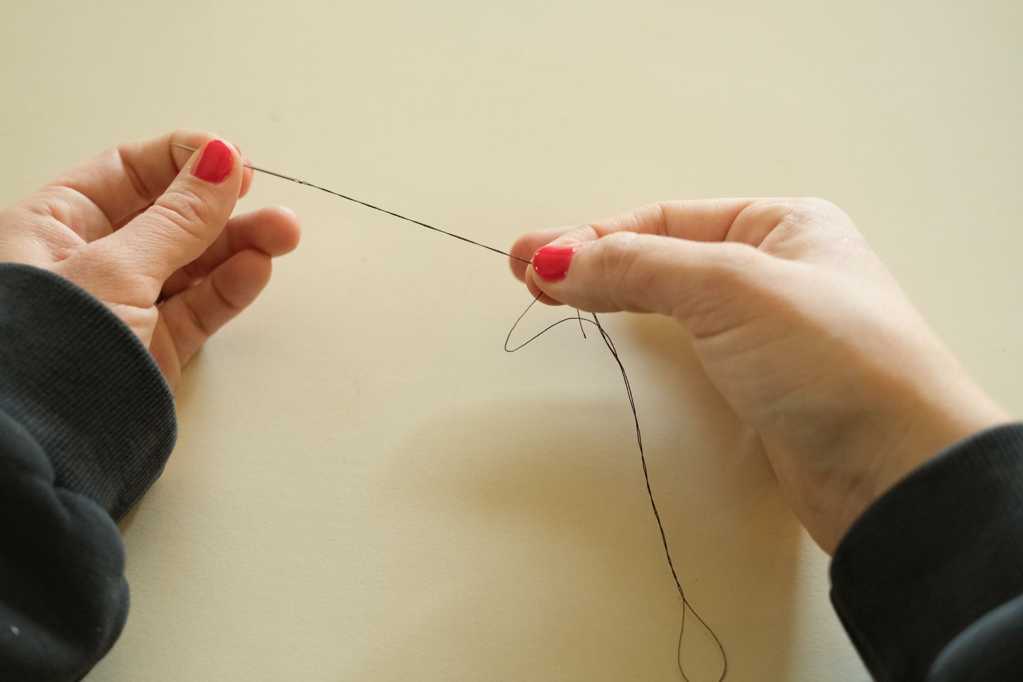 threading a needle for hand sewing