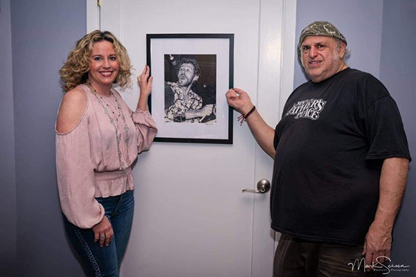 Amy Helm and Eppy with picture of Levon Helm. Photo courtesy of Mark Schoen.