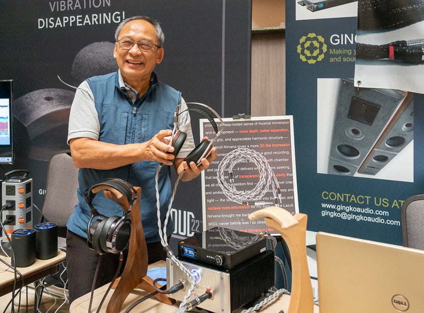 Vinh Vu of Gingko Audio and Danacable was all smiles, holding HIFIMAN Susvara headphones with Danacable Lazuli Nirvana cable going into a Dana-Tone Head-Space headphone amplifier.