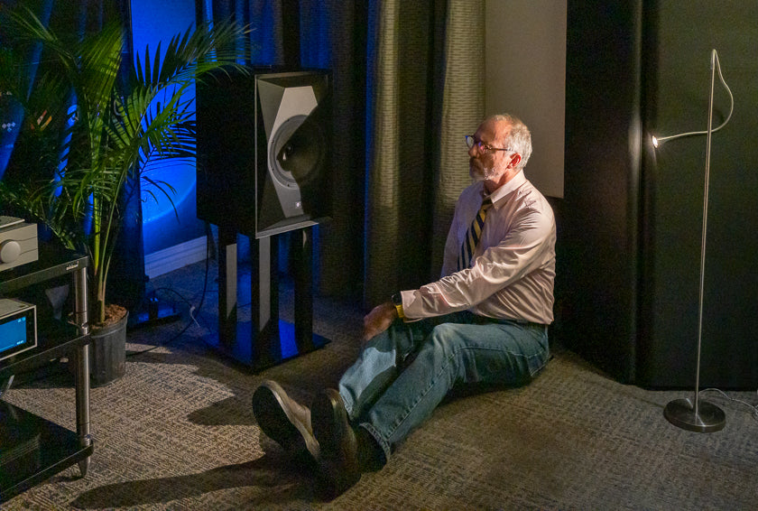 A listener gets up close and personal with Andrew Jones’ new MoFi Electronics SourcePoint 10 loudspeakers in the Mobile Fidelity room.