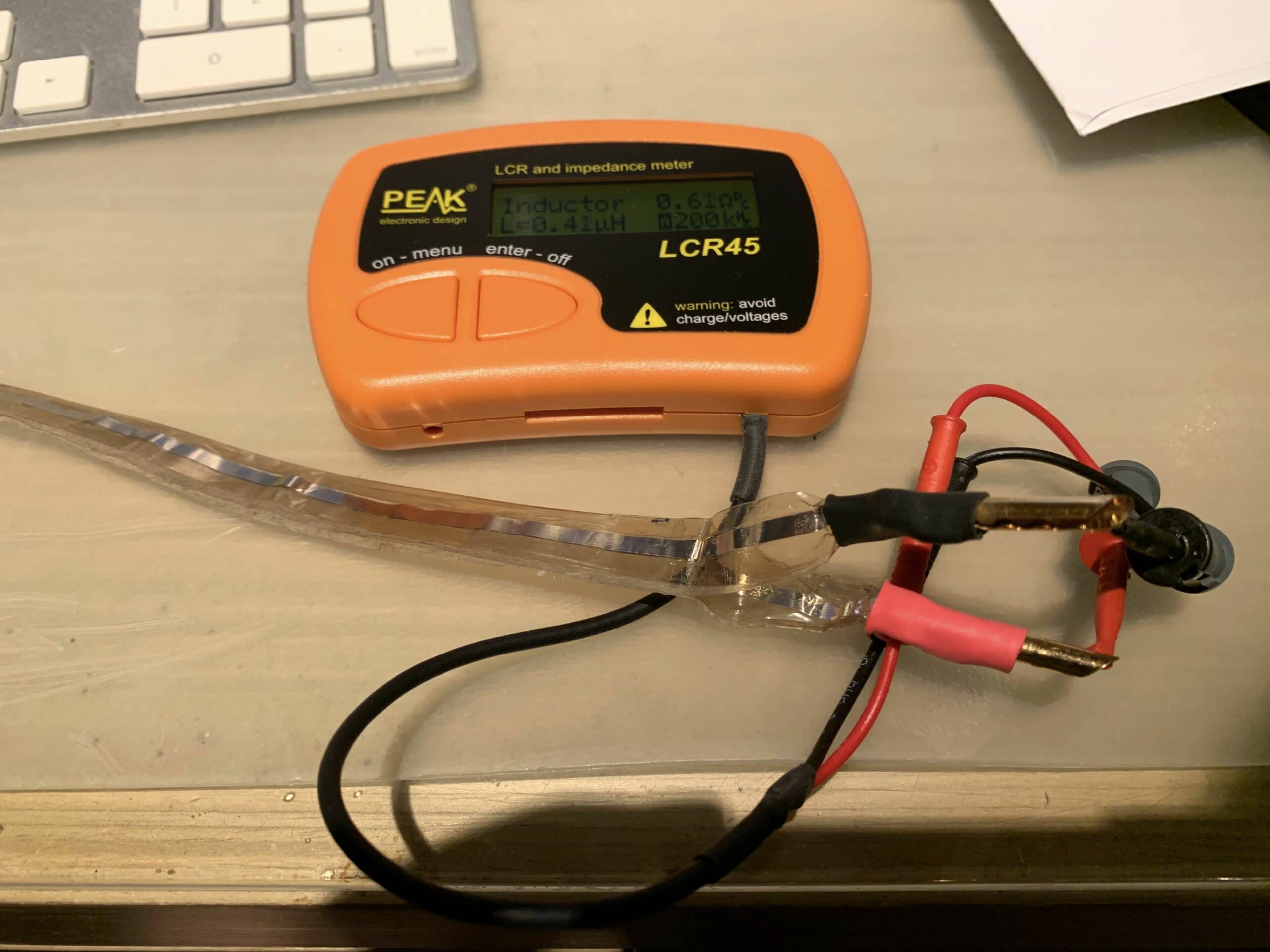 Above: using the Peak LCR45 meter to measure the impedance of my DIY speaker cable. After reading Max Townshend's article in Issue 124, I measured the characteristic impedance of my DIY silver foil speaker cables. With the conductors side by side, the impedance was 340 ohms. Placing the foils on top of each other reduced the impedance to 30 ohms, which should work well enough for my 16-ohm drivers. Readers with long runs of interconnects should also check the capacitance of the cables to make sure there is no significant high-frequency rolloff. The rolloff frequency is equal to 1/(2 x pi x output impedance x cable capacitance). The output impedance of the equipment should be listed in the owner's manual. I would advise allowing a rolloff frequency of no lower than 100 kHz to minimize change in the phase spectrum.