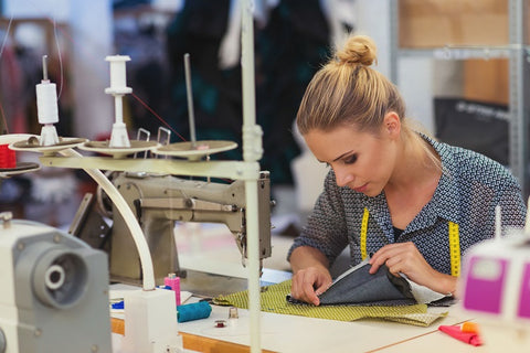 A member of the team working at A Little Pillow Company