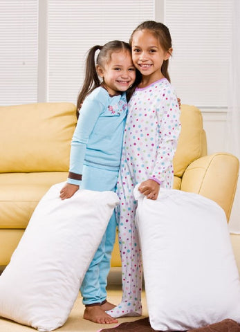 Two girls with A Little Pillow Company Child Pillows