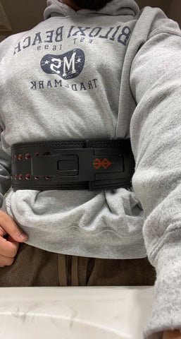 Alijah J showing off his berserk lifting belt