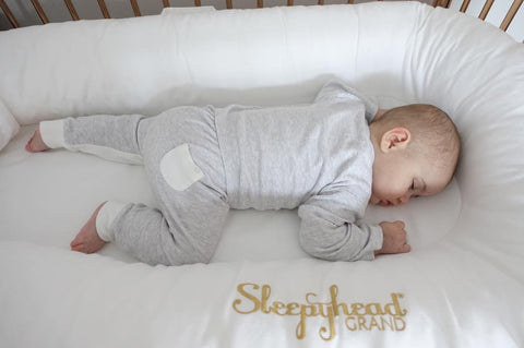 Baby sleeping wearing MORI in a Sleephead