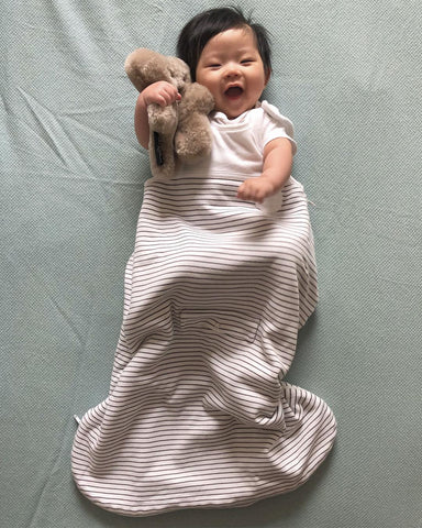 baby wearing a safe baby sleeping bag