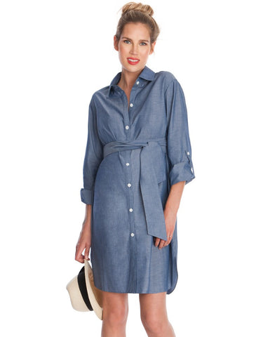 Pregnant woman wearing denim shirt dress with tie around