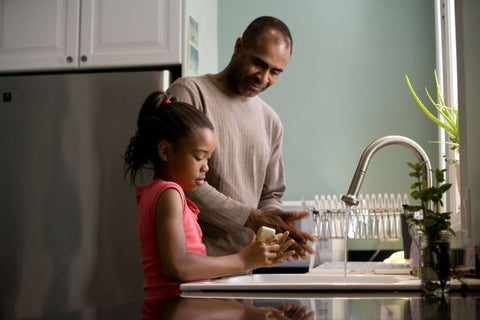 dad with daughter in the kitchen