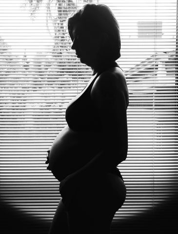 pregnant woman in shadow