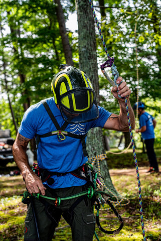 man checking ropes for rescue