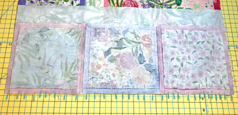 Adding pins along a quilt seam to ease in fullness