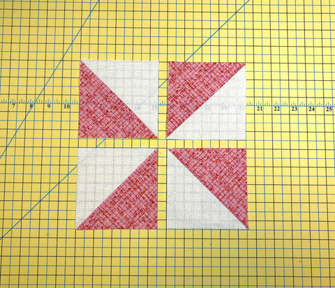 Lay out the half square triangles for the pinwheel block