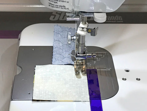 The use of a leader fabric while quilt piecing on a sewing machine