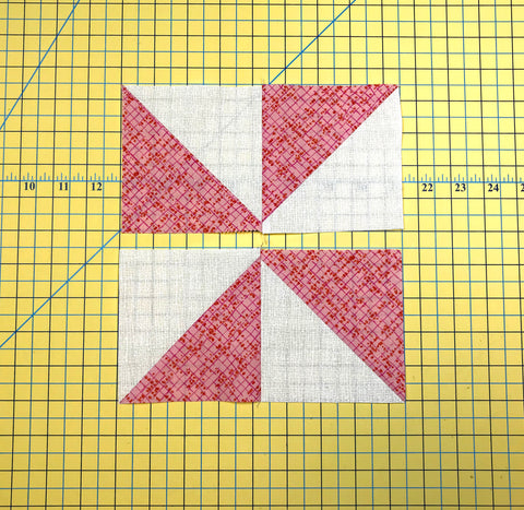 Sew the half square triangles together to make the Pinwheel block