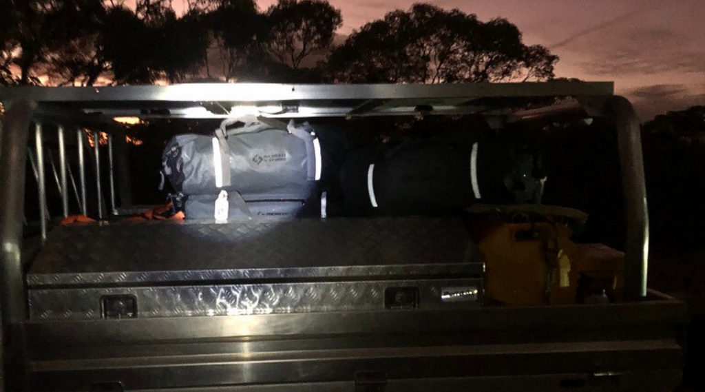 North Storm Waterproof duffel bags on the back of a ute