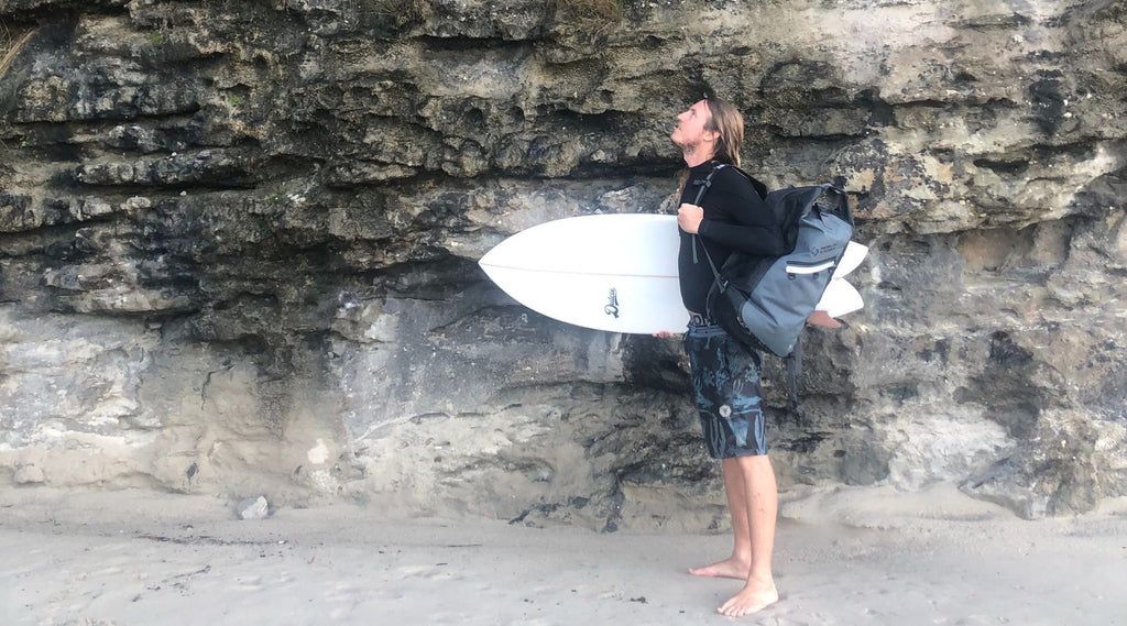 DYLAN FROM WOEBEGONE FREEDIVE WITH A SURF BOARD AND NORTH STORM WATERPROOF BACKPACK