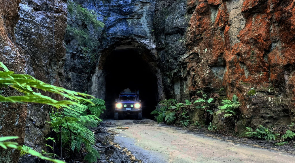 A 4X4 PARKED IN A TUNNEL.
