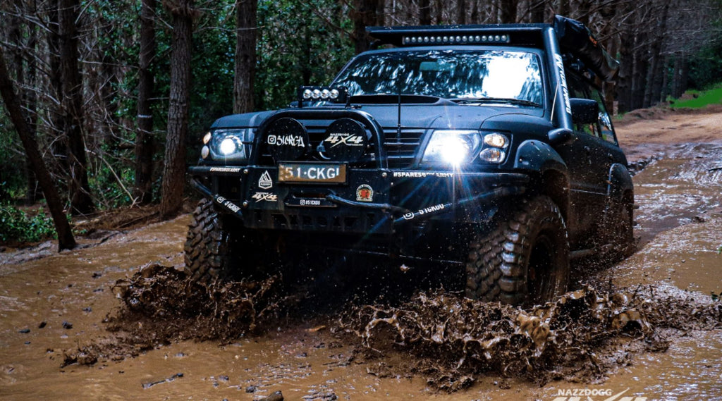 GAZ DRIVING THROUGH SOME THICK MUD OUT BUSH IN HIS FOUR WHEEL DRIVE - NORTH STORM AMBASSADOR.