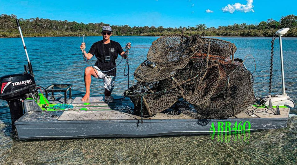 TIMMY TURTLE WITH A PILE OF CRAB POTS ON HIS SKIFF