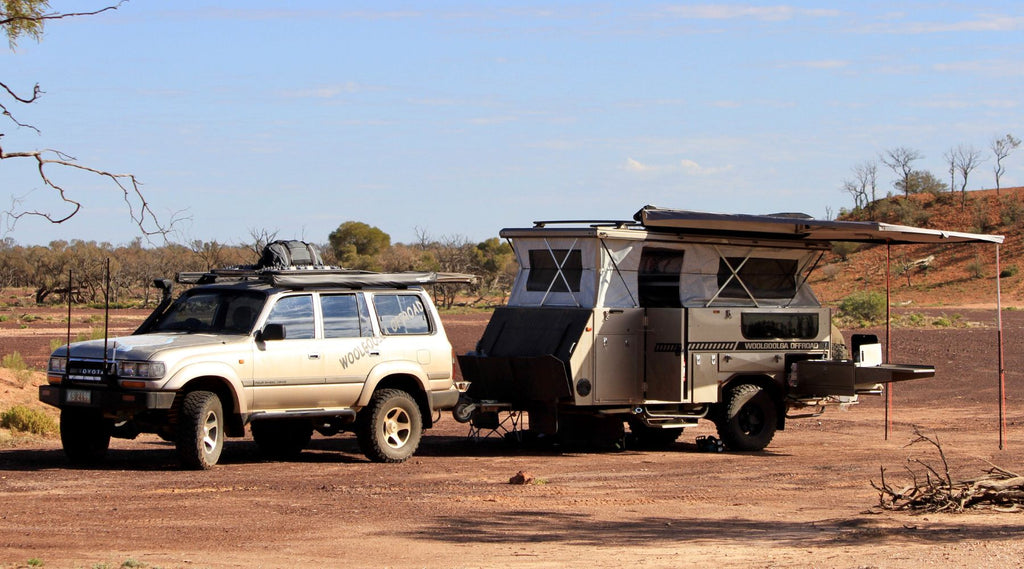 North Storm waterproof 60 Litre Duffel on the roof racks of a four wheel drive in the outback of Australia.