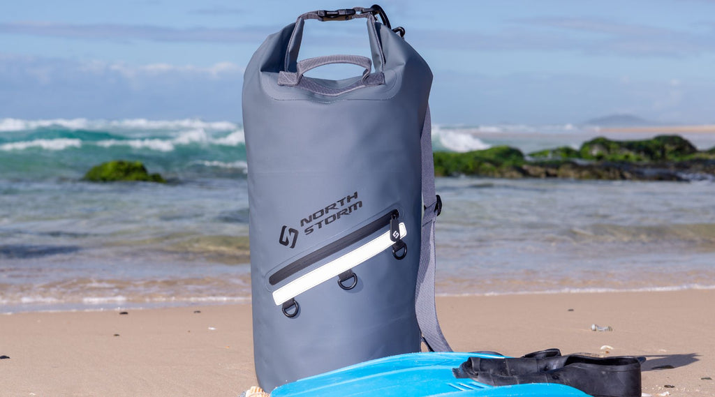 A North Storm 20 litre waterproof dry bag on the beach.