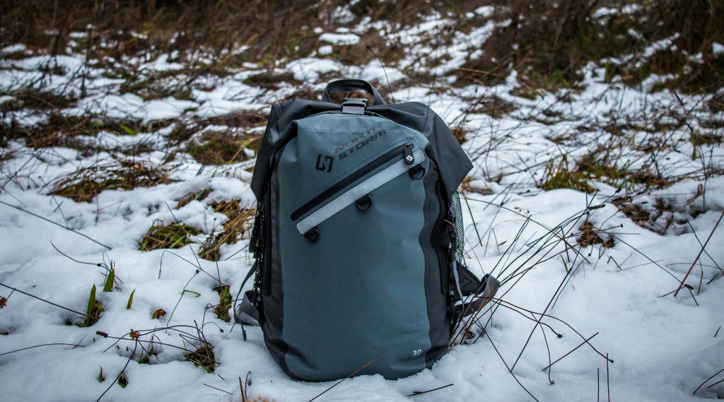 A North Storm 30 litre backpack sitting in the snow.