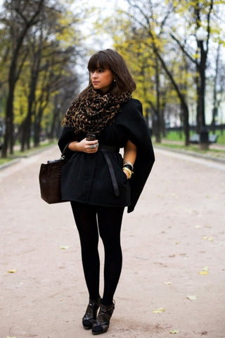 Miroslava Duma in all black with animal print scarf