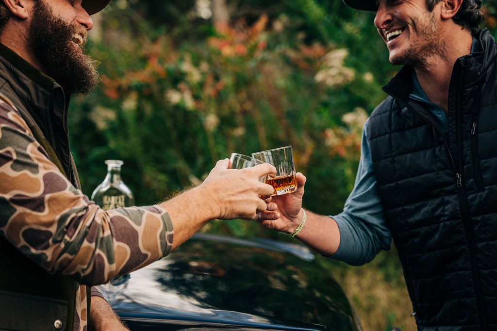 Two men sharing a drink