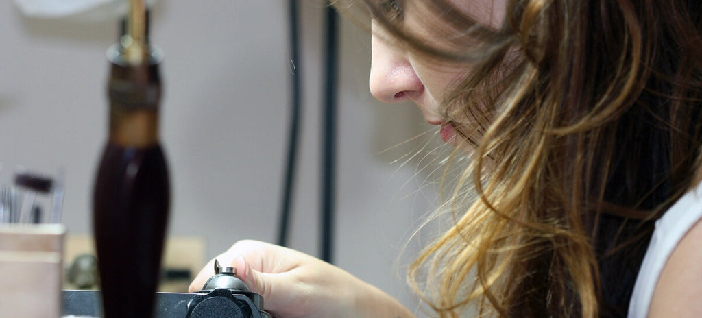 a person making jewelry