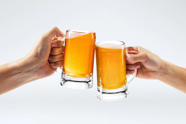 Two people holding beer.