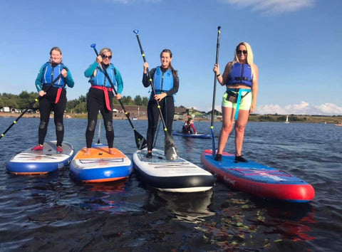 4 girls on paddleboards